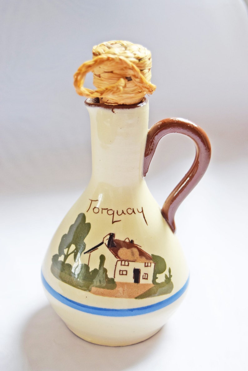 RARE FIND St. Marychurch Pottery Torquay  Vinegar Bottle  
Condition: As new.  Used for display only.  No chips, cracks or crazing.

Height: 14cms
Width: 8cms