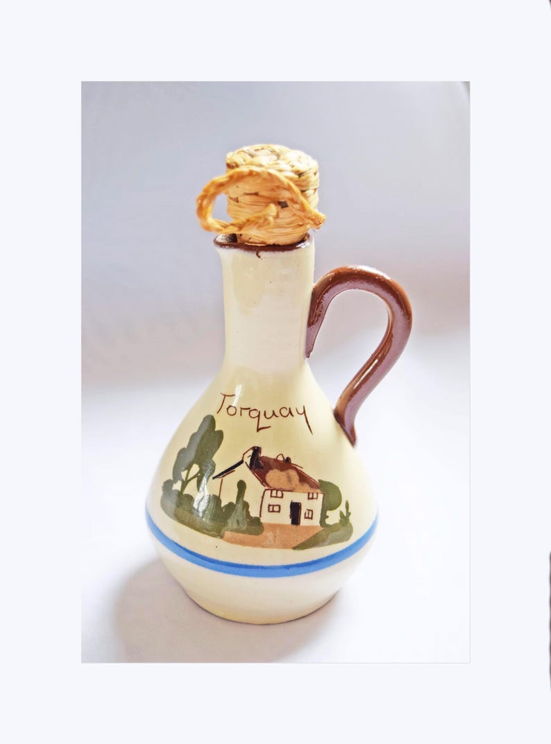 RARE FIND St. Marychurch Pottery Torquay  Vinegar Bottle  
Condition: As new.  Used for display only.  No chips, cracks or crazing.

Height: 14cms
Width: 8cms