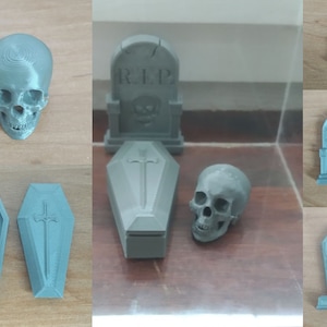 May include: A set of 3D printed Halloween decorations, including a skull, a coffin, and a tombstone. The tombstone has the inscription "RIP" on it.