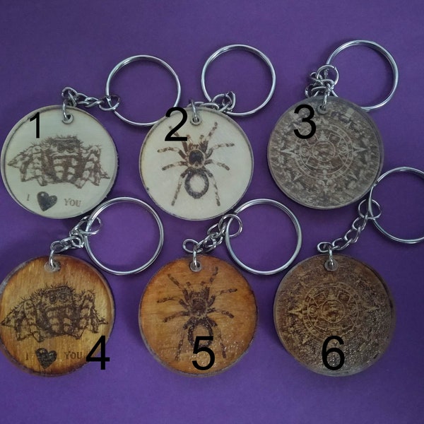 Round keychain, wooden keychain, laser engraved motif, covered with plexiglass. Jumping spider, spider, Mayan calendar.
