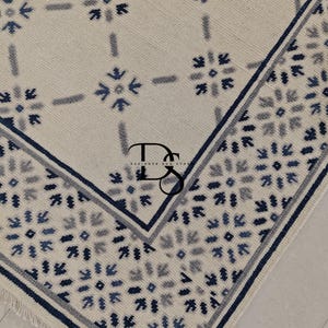 Handmade Wool Area Rug: Geometric Floral, Blue Accents