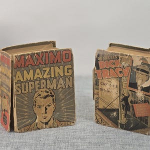 May include: Two vintage comic books. One features "MAXIMO THE AMAZING SUPERMAN" with a portrait of a man. The other is "DETECTIVE DICK TRACY" with a man in a hat. Both books have aged, worn covers.