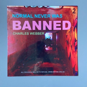 May include: A red and orange album cover with graffiti art. The album title is "NORMAL NEVER WAS BANNED" in pink and blue letters. The artist's name is "CHARLES WEBBER" in white letters. The album number is "2" in white letters in the top right corner. The text "ALL PROCEEDS WILL GO TO REFUGE - WWW.REFUGE.ORG.UK" is at the bottom of the cover.
