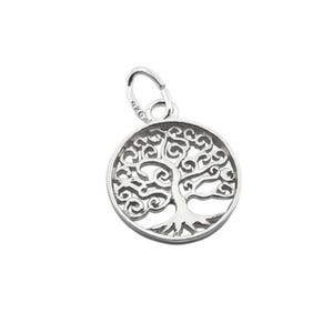 May include: A silver-colored pendant featuring a detailed tree of life design within a circular frame. The pendant has a small loop at the top for a chain. The tree's branches and roots are intricately crafted.