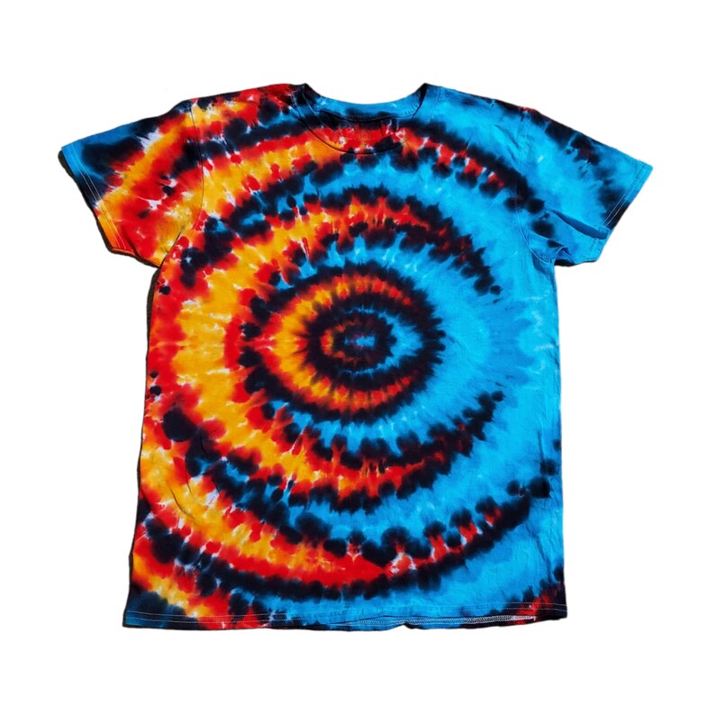 May include: A tie-dye t-shirt with a blue, orange, red and black spiral pattern.
