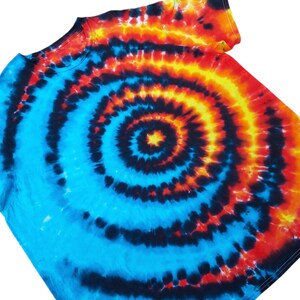 May include: A blue, black, orange and yellow tie-dye t-shirt with a spiral pattern.
