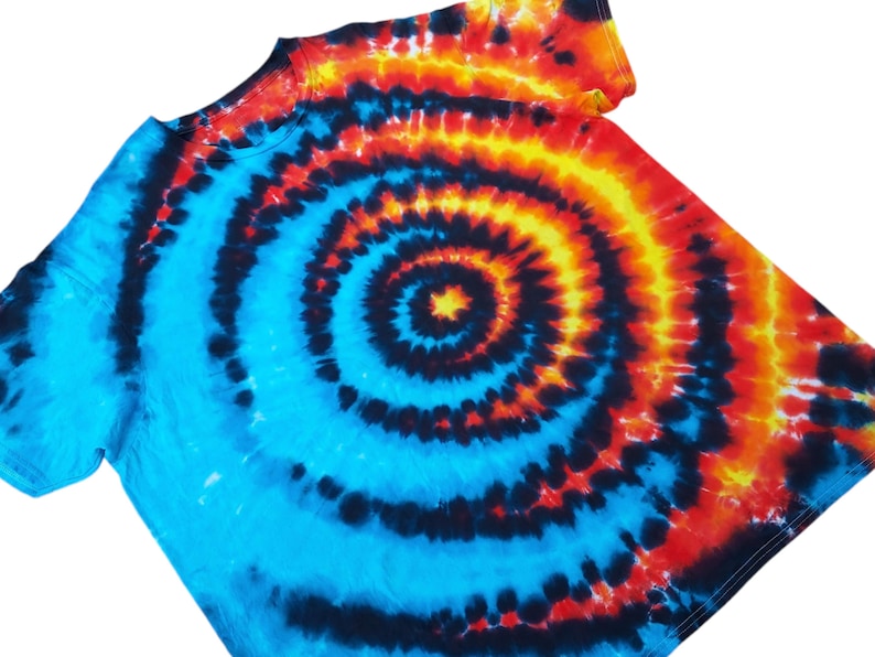 May include: A blue, black, orange and yellow tie-dye t-shirt with a spiral pattern.