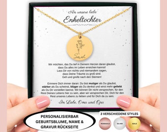 May include: A gold necklace with a round pendant featuring a floral design and the name "Sarah" engraved on it. The necklace is displayed in a black box with a white background and text that reads "An unsere liebe Enkeltochter" and a message about believing in dreams. The text also says "Personalized with birth flower, name & engraving on the back" and "3 different styles: rose gold, silver, gold".