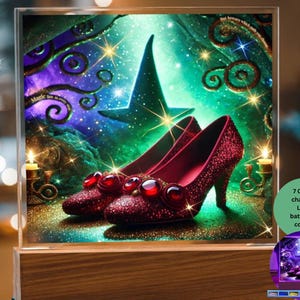 May include: A glass cube night light with a colorful image of a witch's hat and two red sparkly shoes with ruby red gems. The text "Magic lies in every moment" is visible in the image. The night light has 7 color changing LED lights and can be powered by battery or cord.