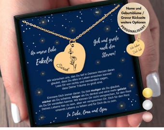 May include: A gold heart-shaped necklace with a delicate floral design and the name "Sarah" engraved on it. The necklace is in a blue box with a message that reads "An unsere liebe Enkelin Sarah" and "Geh und greife nach den Sternen!"  The box also includes a smaller gold heart charm with the text "Wir haben Dich lieb".