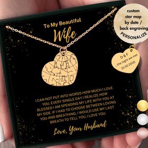 May include: A gold heart-shaped necklace with a star map design. The necklace comes in a black box with a message that reads "To My Beautiful Wife". The box also includes a smaller heart-shaped charm with the text "D&F...the night we met 15.02.2005".