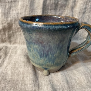 Small mug with drippy blue glaze