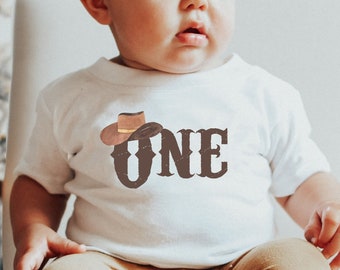 Cowboy Hat ONE 1st Birthday Baby T-Shirt | Rodeo Wild West Cow Boy Brown Toddler Tee Shirt