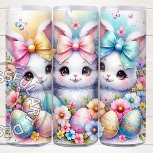 May include: Three 20 oz. stainless steel tumblers with a spring-themed design. Each tumbler features a cute bunny with a bow and pastel-colored Easter eggs. The tumblers are surrounded by colorful flowers.