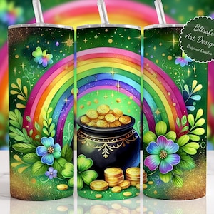 May include: A green tumbler with a St. Patrick's Day design featuring a rainbow, pot of gold, and shamrocks. The tumbler has a straw and the text "Blissful Art Designz". The design includes colorful flowers and gold accents.