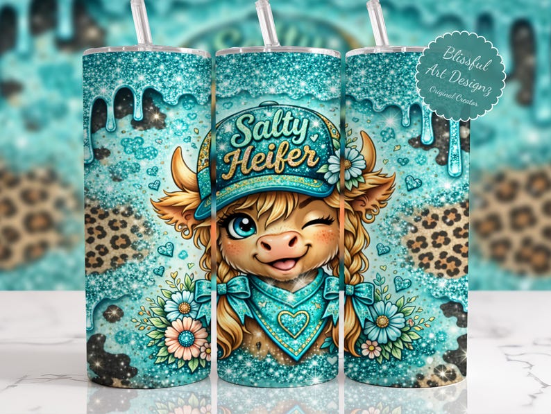 May include: A turquoise tumbler with a cartoon cow wearing a hat that says "Salty Heifer." The tumbler has a glittery design with a leopard print pattern and a straw. The design includes flowers and hearts.