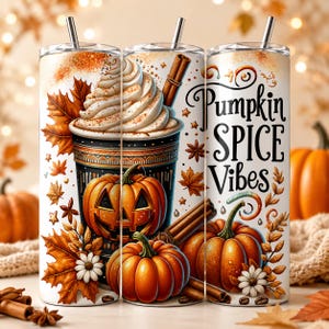 May include: A cylindrical tumbler featuring a graphic of a coffee drink topped with whipped cream, a jack-o'-lantern, orange pumpkins, cinnamon sticks, and autumn leaves. The text Pumpkin SPICE Vibes is printed in black script on the side.