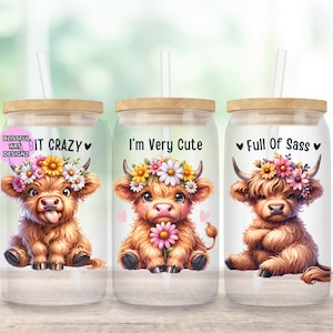 May include: Three glass tumblers with bamboo lids and straws, each featuring a watercolor illustration of a Highland cow wearing a flower crown. Text on the tumblers reads "IT CRAZY", "I'm Very Cute", and "Full of Sass".