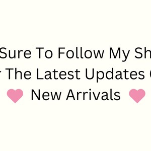 May include: Text graphic with pink hearts on either side that reads "Be Sure To Follow My Shop For The Latest Updates On New Arrivals"
