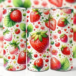 May include: A white tumbler with a red and green strawberry pattern. The tumbler is made of stainless steel and has a double-walled design to keep drinks cold or hot.