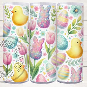 May include: Three 20 oz skinny tumblers with a white background and a colorful Easter pattern. The pattern includes pastel pink, blue, yellow, and green eggs, chicks, bunnies, and flowers.