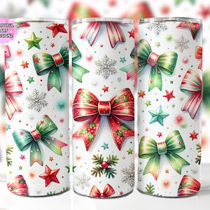 May include: Three white stainless steel tumblers with a festive Christmas design. The design features red and green bows, stars, and snowflakes. The tumblers are decorated with a watercolor style pattern.