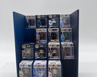 May include: A dark blue tiered display stand featuring the text The Soda Coaster, holding fourteen Star Wars Funko Pop vinyl figures in their original boxes, including characters like Darth Vader, Stormtrooper, Luke Skywalker, and C-3PO.