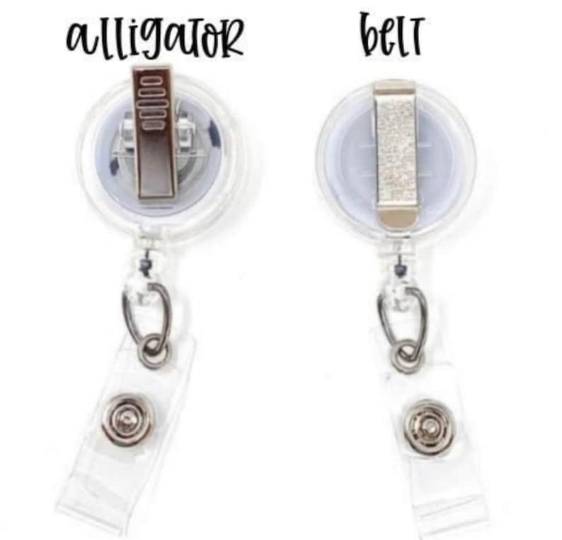 May include: Two clear plastic retractable badge holders with alligator clips and belt clips. The clips are silver and the holders are clear.