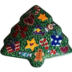 May include: A Christmas tree-shaped serving platter with a green background and festive decorations. The decorations include candy canes, stars, hearts, gifts, and a gingerbread man. The platter is painted with bright colors.