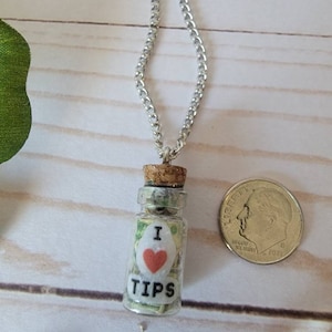 Tiny glass tip jar