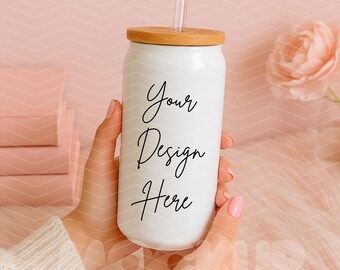 May include: White reusable tumbler with a wooden lid and a straw. The tumbler has the text "Your Design Here" written on it.