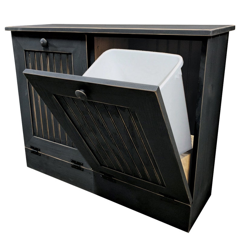 May include: Black wooden trash can with a hinged door and a white plastic bin inside. The door is open and the bin is partially visible.