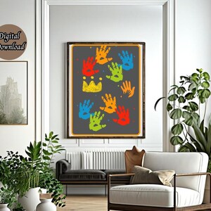 May include: A digital download of a printable art print featuring a gray background with colorful handprints and a crown. The handprints are in shades of red, orange, yellow, green, blue, and purple.