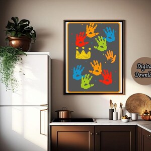 May include: A digital download of a printable art print featuring a black background with colorful handprints in a rainbow pattern. The handprints are arranged in a crown shape with a yellow crown at the top. The text "Digital Download" is in the bottom right corner.