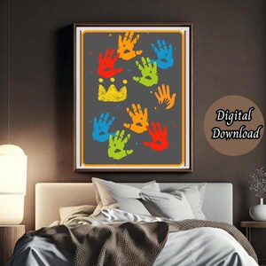 May include: A digital download of a printable art print featuring a colorful design of handprints in a rainbow pattern. The handprints are arranged in a cluster and are surrounded by small white dots. The design is set against a black background and is framed in a simple black frame.