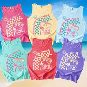 May include: Six brightly coloured vest tops, each printed with the text "Running Crew Most Likely To" and phrases such as "Take a Selfie" and "Get Lost." The designs include sunglasses and palm trees, with a checkered flag pattern.