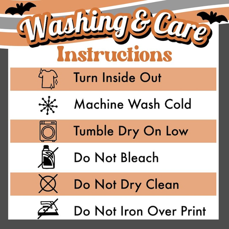 May include: A rectangular washing and care instructions sign with a Halloween theme featuring bats and orange, white, and gray stripes. The text reads: Washing & Care Instructions, Turn Inside Out, Machine Wash Cold, Tumble Dry On Low, Do Not Bleach, Do Not Dry Clean, Do Not Iron Over Print.