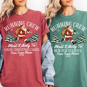 May include: Two crewneck t-shirts in crimson and light green featuring a graphic of Santa Claus running with a sack. Text reads RUNNING CREW, Most Likely To CAUSE CHRISTMAS CHAOS or RUN FOR COOKIES, Your Team Name, and 2026.