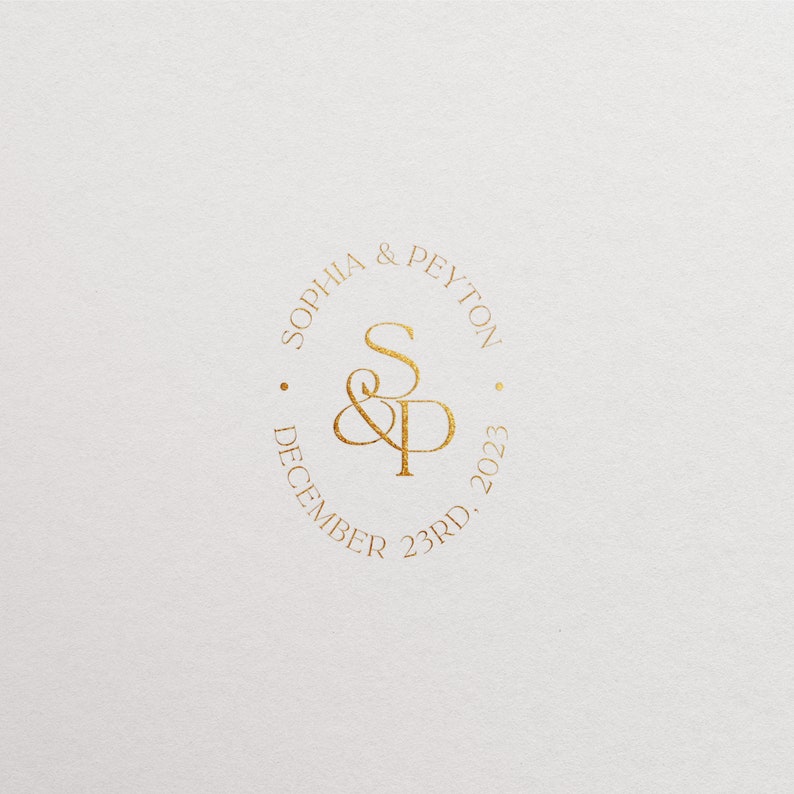 May include: Gold circle with the text "Sophia & Peyton" and "December 23rd, 2023" around the outside. The initials "S&P" are in the center.