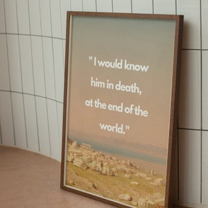 May include: A framed print with a quote about knowing someone in death, "I would know him in death, at the end of the world."