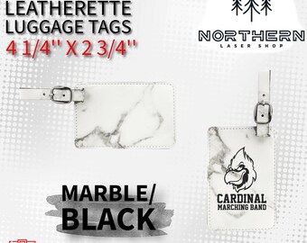 May include: White leatherette luggage tag with a marble pattern and black text that reads "LASERABLE LEATHERETTE LUGGAGE TAGS 4 1/4" X 2 3/4"". The tag has a black strap and a silver buckle. The tag is next to a white leatherette luggage tag with a marble pattern and a black cardinal mascot with the text "CARDINAL MARCHING BAND".