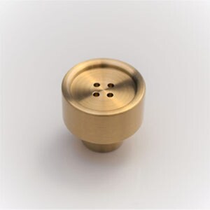 May include: A gold-toned metal button-shaped cabinet knob with four holes.
