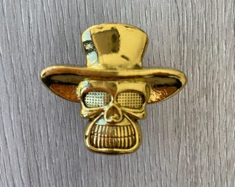 El pomo de la calavera con sombrero - Oro viejo