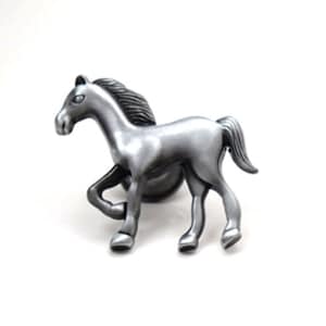 May include: A silver-toned metal horse figurine. The horse is depicted in a running pose with its head turned to the side.