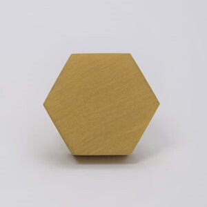 May include: A gold hexagonal tile with a brushed finish.