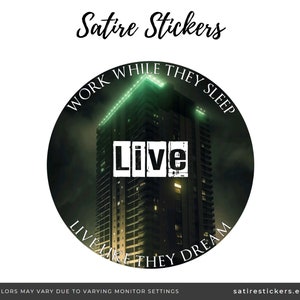 May include: A round sticker with a black background and white text. The text reads "Work while they sleep, Live like they dream". A tall building with green lights is in the center of the sticker. The text "Live" is in large white letters on the building.