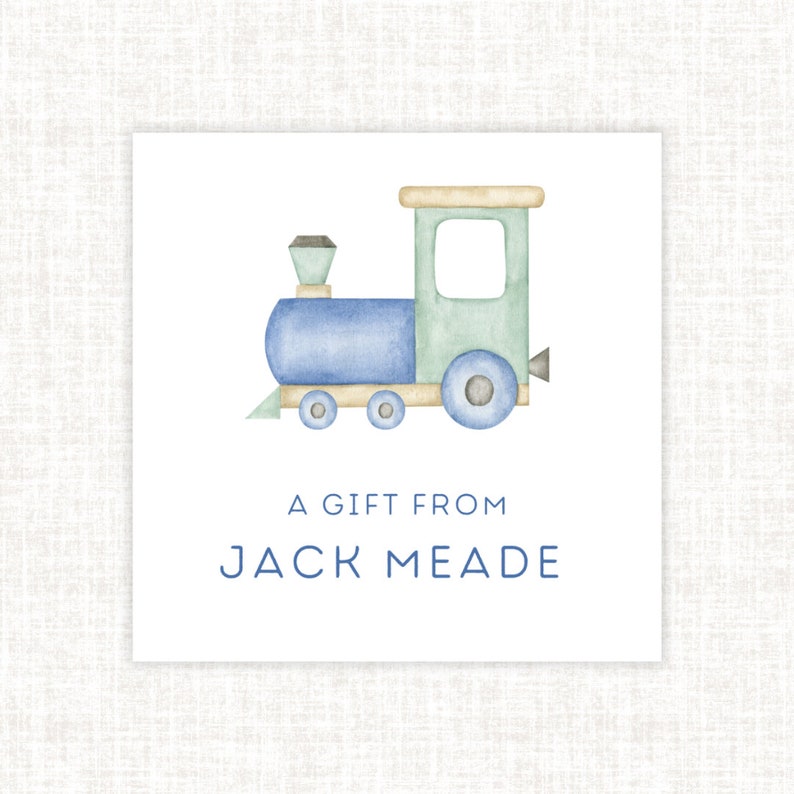 May include: A blue and green watercolour illustration of a toy train with the text "A Gift From Jack Meade".