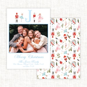 May include: A Christmas card featuring a family photo with the text "Merry Christmas The Jones Family Est. Sharon, Mands (10), Tolle (11), and Love (2)" and a blue letter "J" with nutcracker and ballerina illustrations.