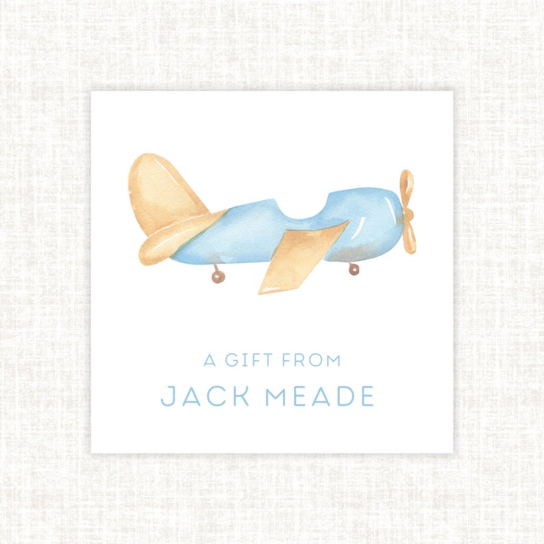 May include: A blue and yellow aeroplane with a propeller on the back. The text "A gift from Jack Meade" is below the aeroplane.