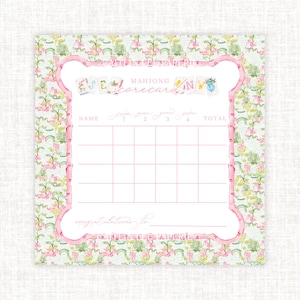 May include: A Mahjong score card with a floral pattern in pink and green. The card has a pink border and includes spaces for name, scores, and total. The words "Mahjong scorecards" are at the top, and "congratulations to" at the bottom.